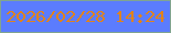 文字の大きさ：3、枠の色：80a490、背景の色：5b7cfe、文字の色：e0831c 無料ブログパーツのブログ時計